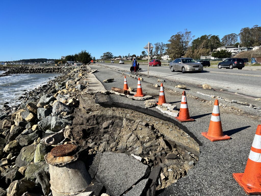 A part of a road next to the ocean collapsed due to erosion