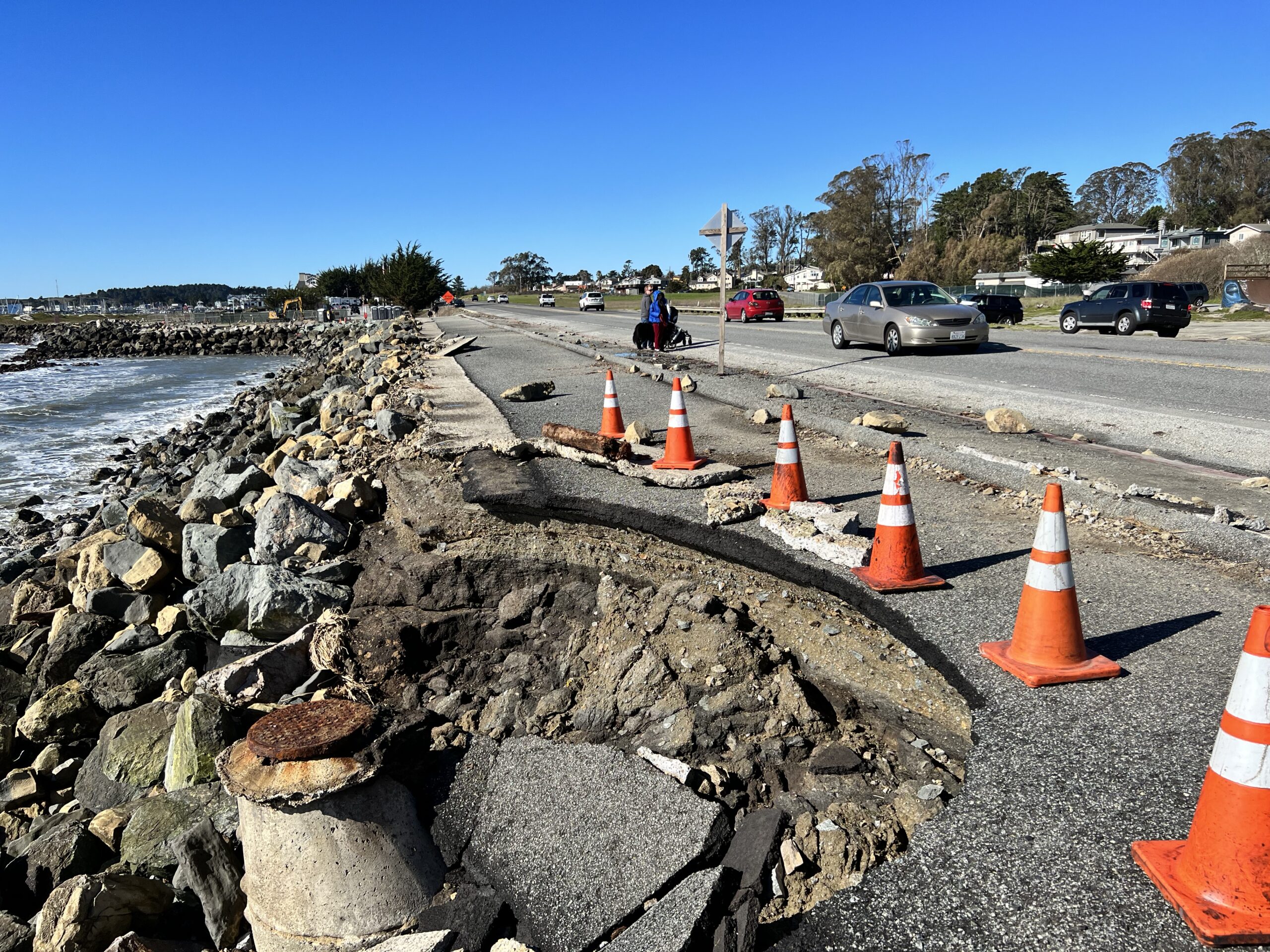 A part of a road next to the ocean collapsed due to erosion