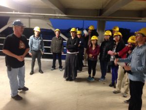 group of people in yellow hard hats